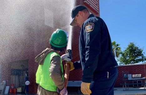 Firefighter assists CERT trainee